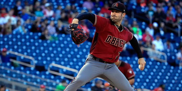 Arizona Diamondbacks starting pitcher Robbie Ray (38) throws a pitch during the first inning of a b...