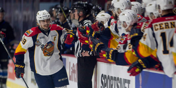 Erie Otters center Dylan Strome celebrates a goal with players on the bench during first period Mem...