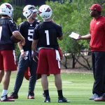 QB coach Byron Leftwich talks with the team's passers during an OTA practice June 1. (Photo by Adam Green/Arizona Sports)