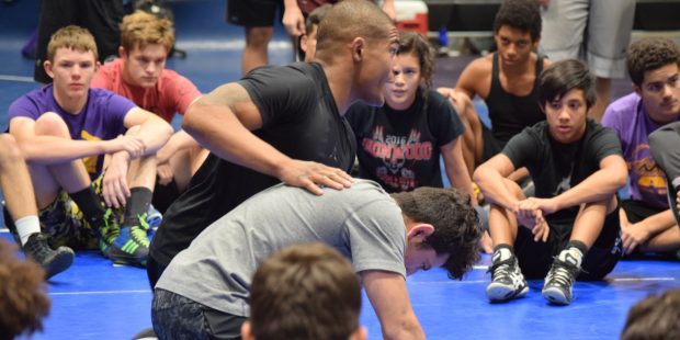 ASU wrestler Antony Robles teaches kids wrestling moves with former Havard and Chandler wrestler Ma...