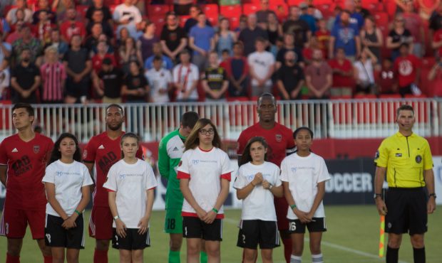 Didier Drogba (right-center) captains Phoenix Rising FC in his June 10th debut against Vancouver Wh...