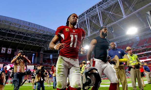 Arizona Cardinals wide receiver Larry Fitzgerald (11) leaves the field after an NFL football game a...