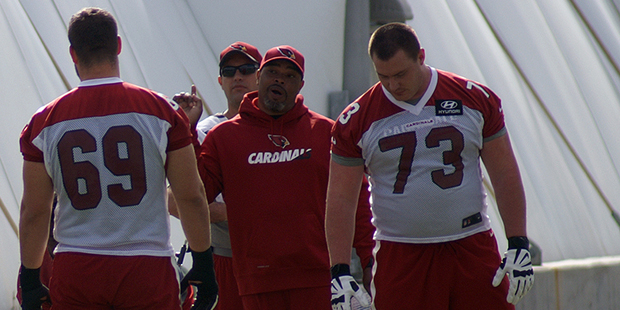 Offensive coordinator Harold Goodwin works with Will Holden and John Wetzel during Arizona Cardinal...