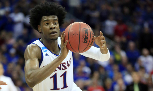 FILE - In this March 25, 2017, file photo, Kansas guard Josh Jackson pass the ball during the secon...