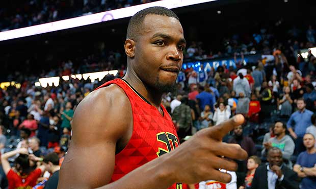 Atlanta Hawks forward Paul Millsap (4) celebrates the overtime victory as he leaves the court after...