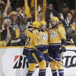 Nashville Predators left wing Viktor Arvidsson, of Sweden, center, celebrates his goal against the Pittsburgh Penguins with teammates defenseman Roman Josi, of Switzerland, , left, and center Mike Fisher, right,during the second period in Game 4 of the NHL hockey Stanley Cup Finals Monday, June 5, 2017, in Nashville, Tenn. (AP Photo/Mark Humphrey)