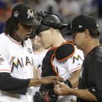 Miami Marlins starting pitcher Jose Urena, left, hands the ball to manager Don Mattingly, right, after being relieved during the fifth inning of the team's baseball game against the Arizona Diamondbacks, Friday, June 2, 2017, in Miami. (AP Photo/Lynne Sladky)