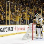 Nashville Predators fans cheer as Pittsburgh Penguins goalie Matt Murray (30) takes a drink after a Predators goal during the third period in Game 3 of the NHL hockey Stanley Cup Finals Saturday, June 3, 2017, in Nashville, Tenn. (AP Photo/Mark Humphrey)