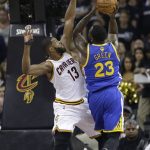 Golden State Warriors forward Draymond Green (23) drives on Cleveland Cavaliers center Tristan Thompson (13) in the first half of Game 4 of basketball's NBA Finals in Cleveland, Friday, June 9, 2017. (AP Photo/Tony Dejak)