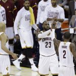 Cleveland Cavaliers forward LeBron James (23) and teammate Kyrie Irving (2) celebrate during the first half against the Golden State Warriors in Game 4 of basketball's NBA Finals in Cleveland, Friday, June 9, 2017. (AP Photo/Tony Dejak)