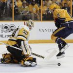 Nashville Predators center Calle Jarnkrok (19), of Sweden, leaps over a puck as Pittsburgh Penguins goalie Matt Murray (30) makes a stop during the first period in Game 3 of the NHL hockey Stanley Cup Finals Saturday, June 3, 2017, in Nashville, Tenn. (AP Photo/Mark Humphrey)