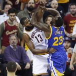Cleveland Cavaliers center Tristan Thompson (13) and Golden State Warriors forward Draymond Green (23) vie for the ball during the first half of Game 4 of basketball's NBA Finals in Cleveland, Friday, June 9, 2017. (AP Photo/Ron Schwane)