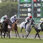 Ascend, ridden by Jose Ortiz, right, approaches the finish line to win the Woodford Reserve Manhattan at Belmont Park on Saturday, June 10, 2017, in Elmont, N.Y. (AP Photo/Julio Cortez)