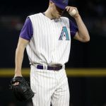 Arizona Diamondbacks' Patrick Corbin adjusts his cap after giving up a run against the San Diego Padres during the first inning of a baseball game, Thursday, June 8, 2017, in Phoenix. (AP Photo/Matt York)