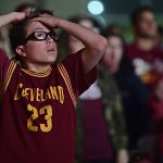 Cleveland Cavaliers fan Jackson Laite, 12, reacts during a watch party outside Quicken Loans Arena for Game 4 of the basketball's NBA Finals between the Cavaliers and the Golden State Warriors, Friday, June 9, 2017, in Cleveland. (AP Photo/David Dermer)