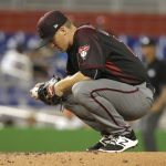 Arizona Diamondbacks starting pitcher Zack Greinke kneels on the mound before pitching during the third inning of the team's baseball game against the Miami Marlins, Thursday, June 1, 2017, in Miami. (AP Photo/Lynne Sladky)