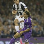 Real Madrid's Luka Modric, right, challenges for the ball with Juventus' Paulo Dybala during the Champions League final soccer match between Juventus and Real Madrid at the Millennium Stadium in Cardiff, Wales, Saturday June 3, 2017. (AP Photo/Tim Ireland)
