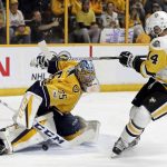 Nashville Predators goalie Pekka Rinne (35), of Finland, stops a shot by Pittsburgh Penguins left wing Chris Kunitz (14) during the second period in Game 4 of the NHL hockey Stanley Cup Finals Monday, June 5, 2017, in Nashville, Tenn. (AP Photo/Mark Humphrey)