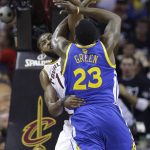Golden State Warriors forward Draymond Green (23) drives on Cleveland Cavaliers center Tristan Thompson (13) during the first half of Game 4 of basketball's NBA Finals in Cleveland, Friday, June 9, 2017. (AP Photo/Tony Dejak)