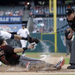 Arizona Diamondbacks' Chris Owings is tagged out by Detroit Tigers catcher Alex Avila as home plate umpire Tom Woodring watches during the first inning of a baseball game, Wednesday, June 14, 2017, in Detroit. (AP Photo/Carlos Osorio)