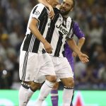 Juventus' Mario Mandzukic, left, celebrates with Juventus' Gonzalo Higuain after scoring during the Champions League final soccer match between Juventus and Real Madrid at the Millennium stadium in Cardiff, Wales Saturday June 3, 2017. (AP Photo/Dave Thompson)