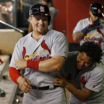 St. Louis Cardinals' Luke Voit, left, smiles as he gets a hug from pitcher Carlos Martinez after Voit scored against the Arizona Diamondbacks during the seventh inning of a baseball game Tuesday, June 27, 2017, in Phoenix. (AP Photo/Ross D. Franklin)