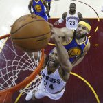 Cleveland Cavaliers forward Richard Jefferson (24) tries to dunk as Golden State Warriors center JaVale McGee (1) defends during the first half of Game 4 of basketball's NBA Finals in Cleveland, Friday, June 9, 2017. (Larry W. Smith/Pool Photo via AP)