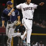 Arizona Diamondbacks' Gregor Blanco (5) scores a run as San Diego Padres' Dinelson Lamet, left, runs to back up the play during the first inning of a baseball game Tuesday, June 6, 2017, in Phoenix. (AP Photo/Ross D. Franklin)