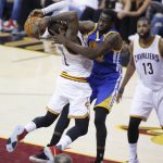 Golden State Warriors forward Draymond Green (23) defends Cleveland Cavaliers guard Kyrie Irving (2) during the first half of Game 4 of basketball's NBA Finals in Cleveland, Friday, June 9, 2017. (AP Photo/Ron Schwane)
