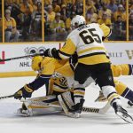 Nashville Predators left wing Filip Forsberg, of Sweden, center, is knocked into Pittsburgh Penguins goalie Matt Murray, bottom, by Ron Hainsey, right, during the first period in Game 3 of the NHL hockey Stanley Cup Finals Saturday, June 3, 2017, in Nashville, Tenn. (AP Photo/Mark Humphrey)