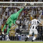 Real Madrid's goalkeeper Keylor Navas is beaten by Juventus' Mario Mandzukic goal during the Champions League final soccer match between Juventus and Real Madrid at the Millennium stadium in Cardiff, Wales Saturday June 3, 2017. (AP Photo/Frank Augstein)