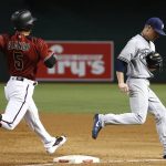 Milwaukee Brewers' Chase Anderson, right, beats Arizona Diamondbacks' Gregor Blanco (5) to first base for an out during the third inning of a baseball game, Sunday, June 11, 2017, in Phoenix. (AP Photo/Ross D. Franklin)