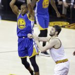 Golden State Warriors forward Andre Iguodala (9) passes as Cleveland Cavaliers forward Kevin Love (0) defends during the first half of Game 4 of basketball's NBA Finals in Cleveland, Friday, June 9, 2017. (AP Photo/Tony Dejak)