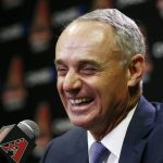Rob Manfred, Commissioner of Major League Baseball, laughs before answering a question during a news conference prior to an Arizona Diamondbacks baseball game against the San Diego Padres Tuesday, June 6, 2017, in Phoenix. (AP Photo/Ross D. Franklin)
