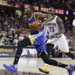 Golden State Warriors forward Kevin Durant (35) drives on Cleveland Cavaliers forward LeBron James (23) during the second half of Game 4 of basketball's NBA Finals in Cleveland, Friday, June 9, 2017. (AP Photo/Tony Dejak)