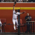 Arizona Diamondbacks' David Peralta makes a leaping catch at the wall on a fly ball hit by St. Louis Cardinals' Randal Grichuk during the second inning of a baseball game, Wednesday, June 28, 2017, in Phoenix. (AP Photo/Ross D. Franklin)