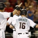 Arizona Diamondbacks' Chris Owings (16) celebrates his three-run home run against the San Diego Padres with Jake Lamb (22) and Brandon Drury during the second inning of a baseball game Tuesday, June 6, 2017, in Phoenix. (AP Photo/Ross D. Franklin)