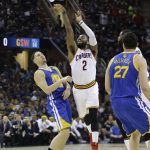 Cleveland Cavaliers guard Kyrie Irving (2) shoots past Golden State Warriors guard Klay Thompson, left, during the first half of Game 4 of basketball's NBA Finals in Cleveland, Friday, June 9, 2017. (AP Photo/Tony Dejak)