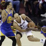 Golden State Warriors forward Draymond Green (23) reaches in on Cleveland Cavaliers forward Richard Jefferson (24) as Shaun Livingston (34) defends during the first half of Game 4 of basketball's NBA Finals in Cleveland, Friday, June 9, 2017. (AP Photo/Tony Dejak)