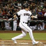 Arizona Diamondbacks' Jake Lamb follows through on a swing for a two-run single against the San Diego Padres during the second inning of a baseball game Tuesday, June 6, 2017, in Phoenix. (AP Photo/Ross D. Franklin)