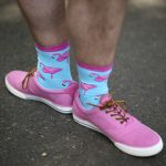 Andy Smith, of London, England, dons pink flamingo socks while walking the grounds of Belmont Park before the 149th running of the Belmont Stakes horse race, Saturday, June 10, 2017, in Elmont, N.Y. (AP Photo/Mary Altaffer)