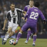 Juventus' Leonardo Bonucci, left, challenges for the ball with Real Madrid's Isco during the Champions League final soccer match between Juventus and Real Madrid at the Millennium Stadium in Cardiff, Wales, Saturday June 3, 2017. (AP Photo/Kirsty Wigglesworth)