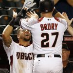 Arizona Diamondbacks' Brandon Drury (27) celebrates his home run against the San Diego Padres with David Peralta, left, during the third inning of a baseball game Wednesday, June 7, 2017, in Phoenix. (AP Photo/Ross D. Franklin)