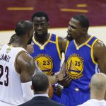 Golden State Warriors forward Kevin Durant (35) argues with Cleveland Cavaliers forward LeBron James (23) during the second half of Game 4 of basketball's NBA Finals in Cleveland, Friday, June 9, 2017. (AP Photo/Ron Schwane)