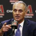 Rob Manfred, Commissioner of Major League Baseball, points to a reporter to ask a question during a news conference prior to an Arizona Diamondbacks baseball game against the San Diego Padres Tuesday, June 6, 2017, in Phoenix. (AP Photo/Ross D. Franklin)