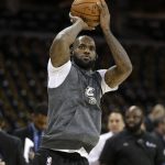 Cleveland Cavaliers forward LeBron James warms up before Game 4 of basketball team's NBA Finals agains the Golden State Warriors in Cleveland, Friday, June 9, 2017. (AP Photo/Tony Dejak)