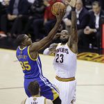 Golden State Warriors forward Kevin Durant (35) drives on Cleveland Cavaliers forward LeBron James (23) during the first half of Game 4 of basketball's NBA Finals in Cleveland, Friday, June 9, 2017. (AP Photo/Tony Dejak)