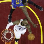 Cleveland Cavaliers forward LeBron James, bottom, drives on Golden State Warriors forward Draymond Green during the first half of Game 4 of basketball's NBA Finals in Cleveland, Friday, June 9, 2017. (AP Photo/Ron Schwane, Pool)