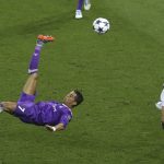 Real Madrid's Cristiano Ronaldo jumps kicking the ball during the Champions League Final soccer match between Juventus and Real Madrid at the Millennium Stadium in Cardiff, Wales, Saturday, June 3, 2017. (AP Photo/Alastair Grant)
