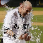 Arizona Diamondbacks' Chris Herrmann gets a bucket of water dumped onto him in celebration after his walk-off single against the St. Louis Cardinals in a baseball game Tuesday, June 27, 2017, in Phoenix. The Diamondbacks defeated the Cardinals 6-5. (AP Photo/Ross D. Franklin)
